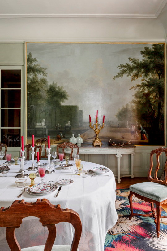 Castle dining room with antic chairs covered by a light green Velvet from la Maison Pierre Frey